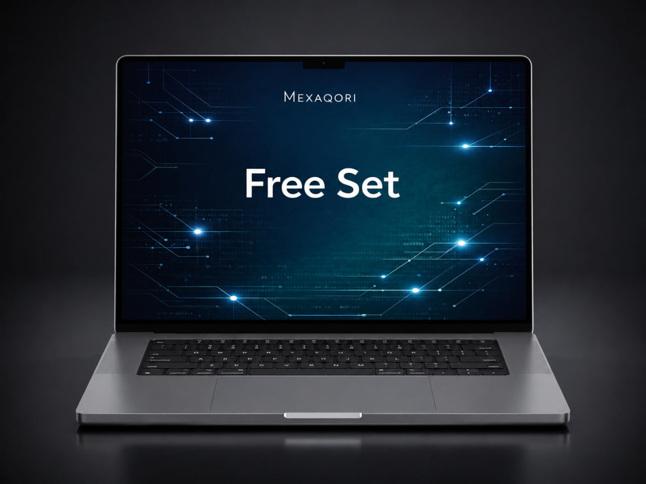 A silver laptop shown open and centered on a dark studio background, with the screen displaying the text 'MEXAGORI Free Set' over a blue tech-style graphic.