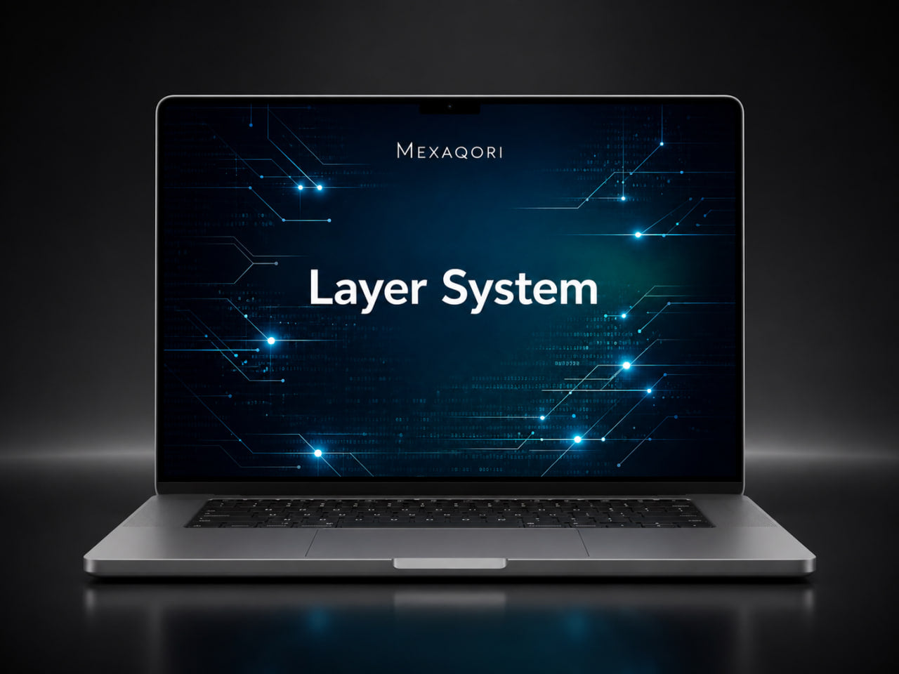 A silver laptop on a dark reflective surface, displaying a blue tech-themed screen with the text 'MEXAQORI' and 'Layer System'.
